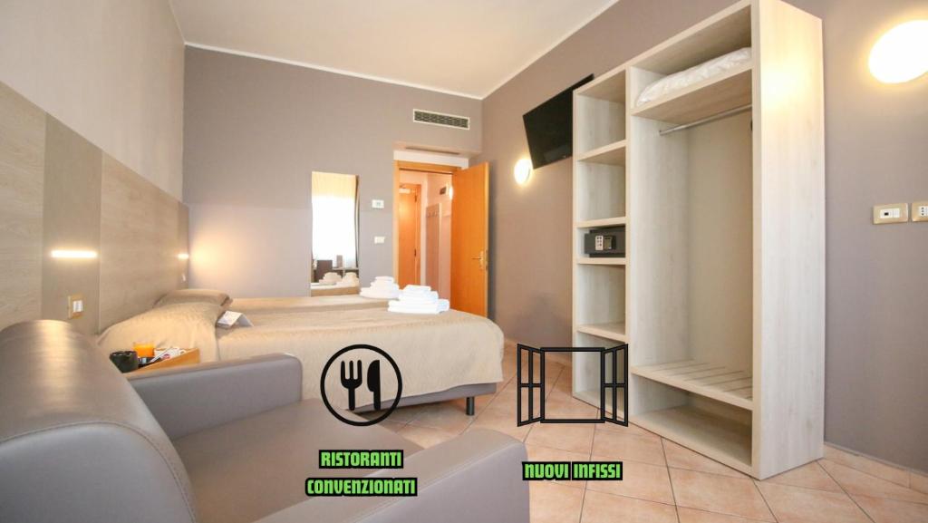 Tempat tidur dalam kamar di Hotel Miramonti