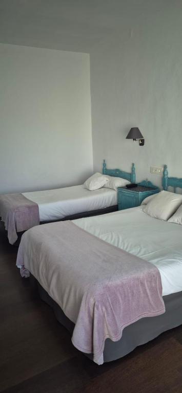 Posteľ alebo postele v izbe v ubytovaní Hotel Lanjaron