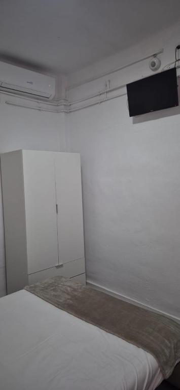 Posteľ alebo postele v izbe v ubytovaní Hotel Lanjaron