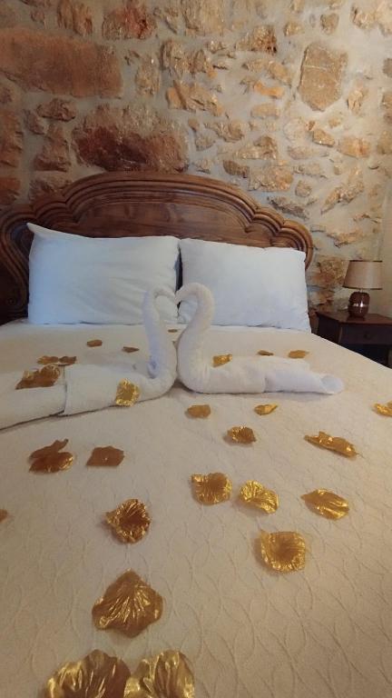 a bed with a bunch of food on it at Casa do casal POIOS in Pombal