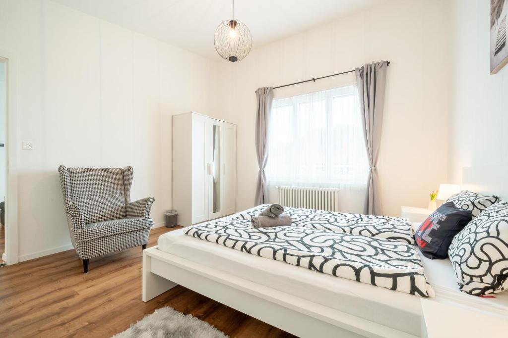 Postel nebo postele na pokoji v ubytování Swissholiday