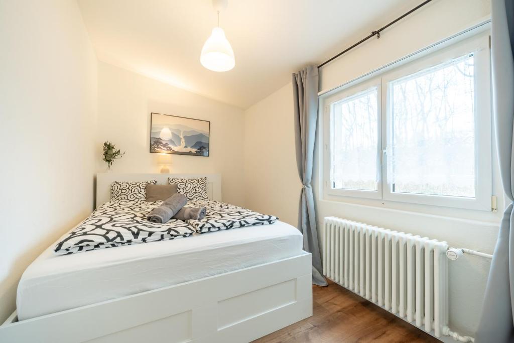 Postel nebo postele na pokoji v ubytování Swissholiday