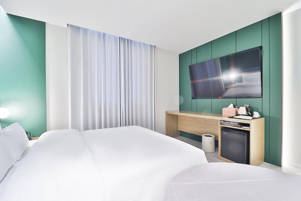 Postel nebo postele na pokoji v ubytování Hotel Ippda Gumdan