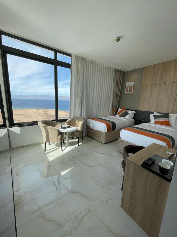 Postel nebo postele na pokoji v ubytování Diamond Palm Hotel & Resort