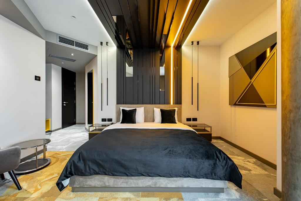 Postel nebo postele na pokoji v ubytování Hotel Ženeva Lux