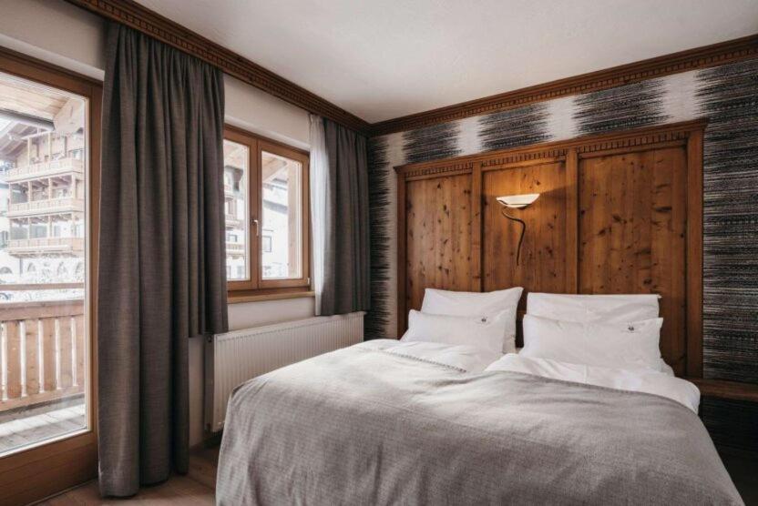 Postel nebo postele na pokoji v ubytování Hotel Oberforsthof