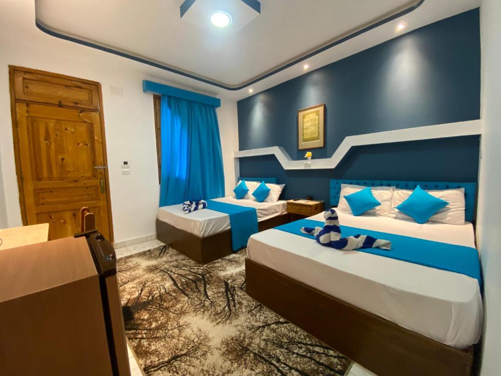 Postel nebo postele na pokoji v ubytování Seaview Hotel Dahab