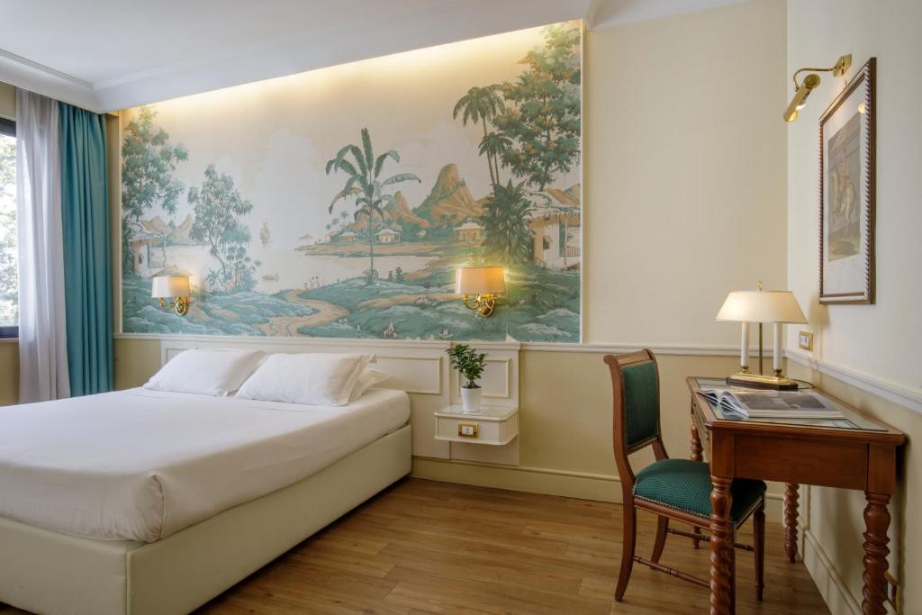 Postel nebo postele na pokoji v ubytování Donna Laura Palace by OMNIA hotels