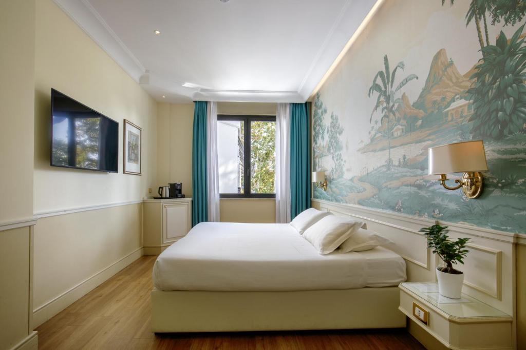 Postel nebo postele na pokoji v ubytování Donna Laura Palace by OMNIA hotels