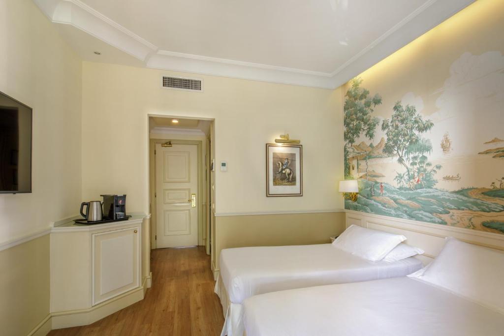 Postel nebo postele na pokoji v ubytování Donna Laura Palace by OMNIA hotels