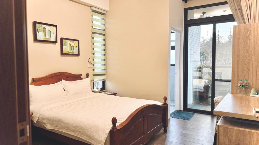 Postel nebo postele na pokoji v ubytování Kinmen 2 Home Puju Homestay