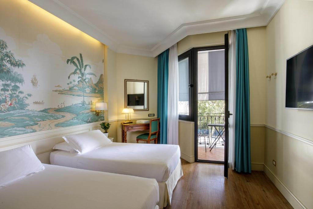 Postel nebo postele na pokoji v ubytování Donna Laura Palace by OMNIA hotels