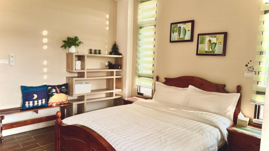 Postel nebo postele na pokoji v ubytování Kinmen 2 Home Puju Homestay
