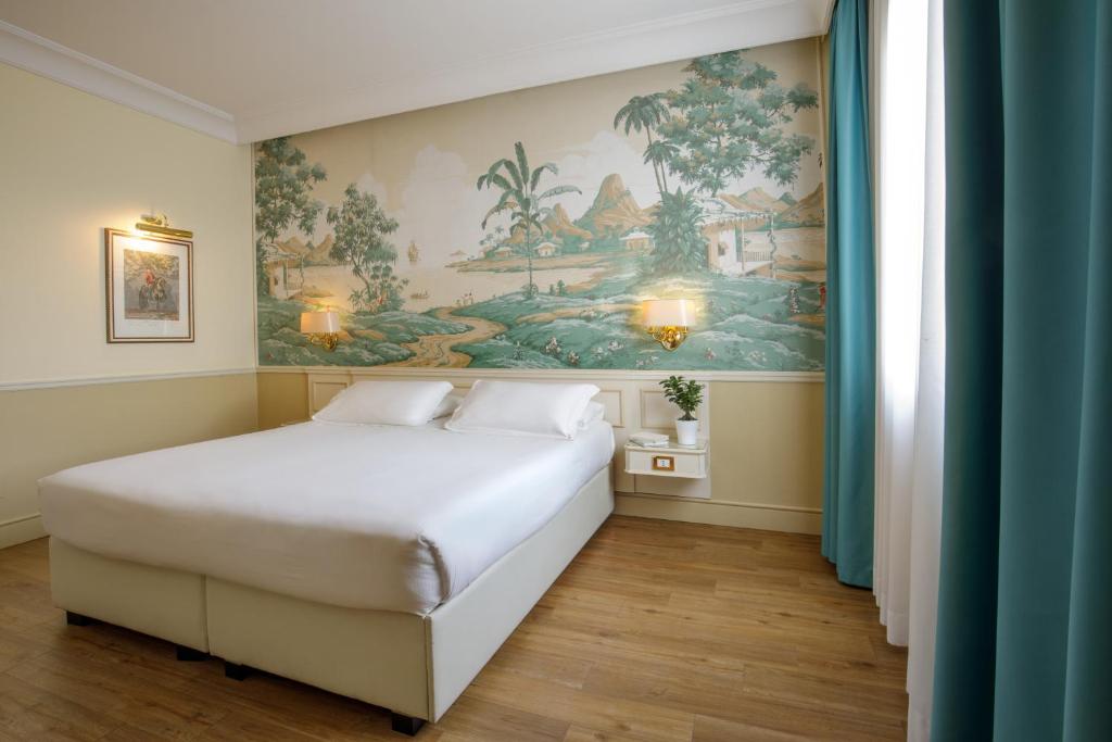 Postel nebo postele na pokoji v ubytování Donna Laura Palace by OMNIA hotels