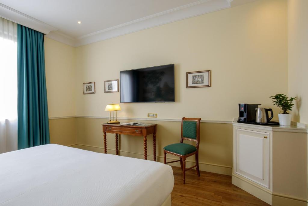 Postel nebo postele na pokoji v ubytování Donna Laura Palace by OMNIA hotels