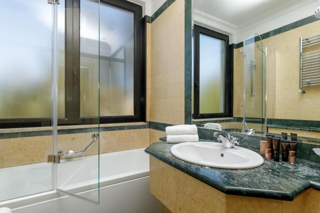 Koupelna v ubytování Donna Laura Palace by OMNIA hotels