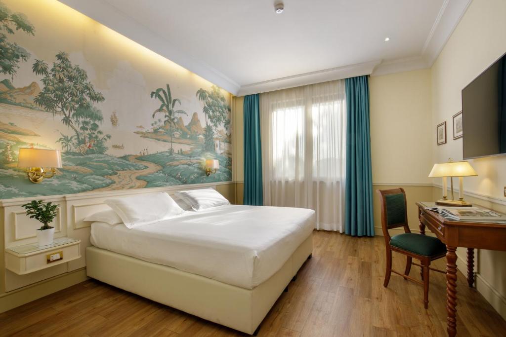 Postel nebo postele na pokoji v ubytování Donna Laura Palace by OMNIA hotels