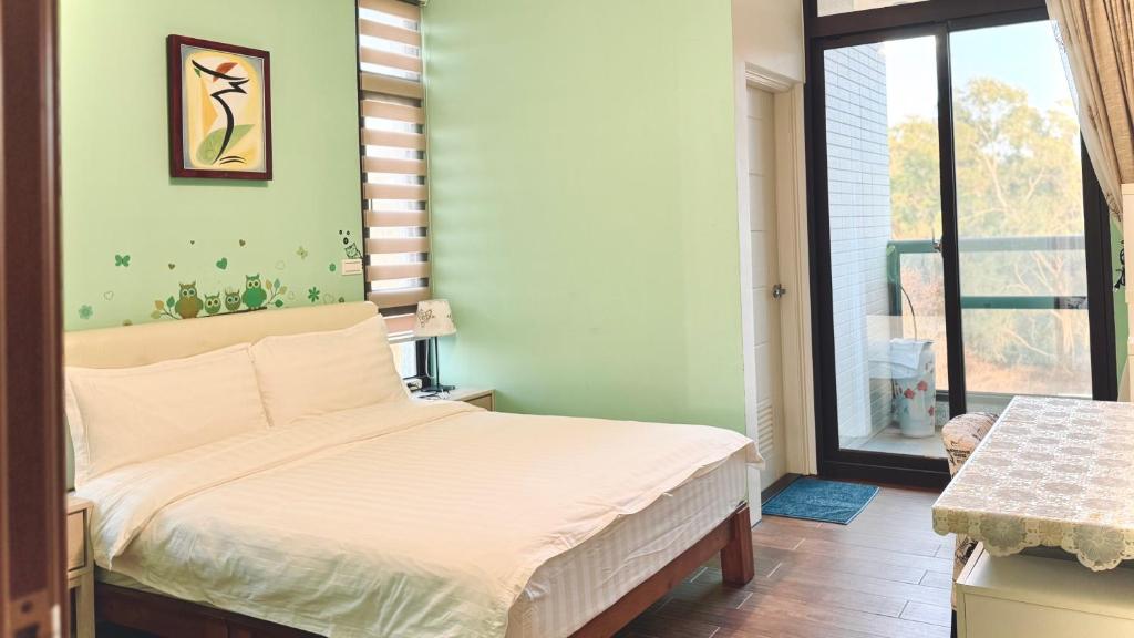Postel nebo postele na pokoji v ubytování Kinmen 2 Home Puju Homestay