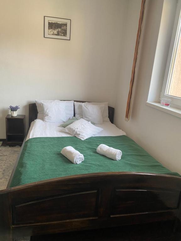 Postel nebo postele na pokoji v ubytování Apartament Borsec