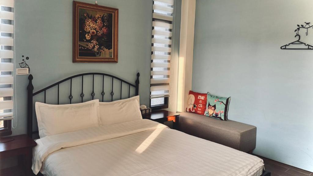 Postel nebo postele na pokoji v ubytování Kinmen 2 Home Puju Homestay