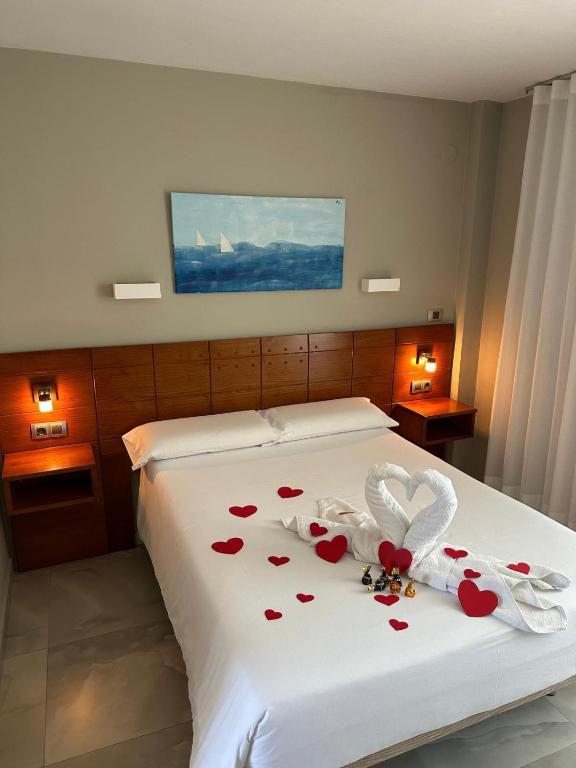 A bed or beds in a room at Hotel Costa Azahar