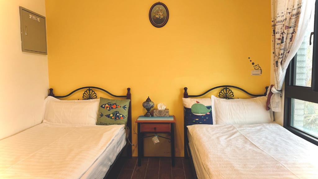 Postel nebo postele na pokoji v ubytování Kinmen 2 Home Puju Homestay
