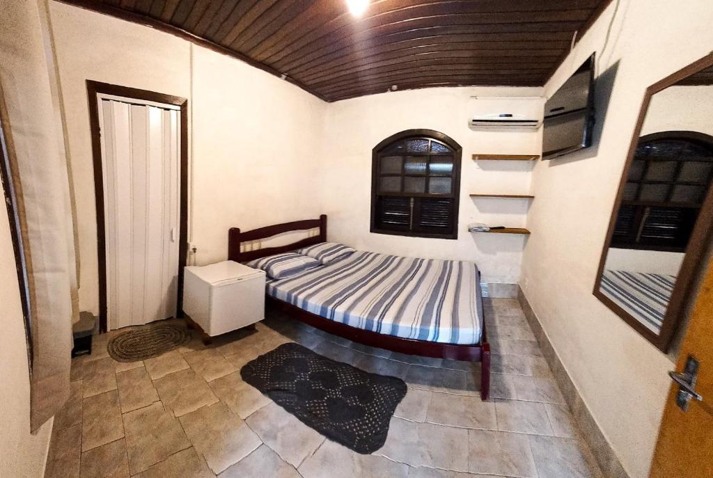 Postel nebo postele na pokoji v ubytování Pousada do Arthur