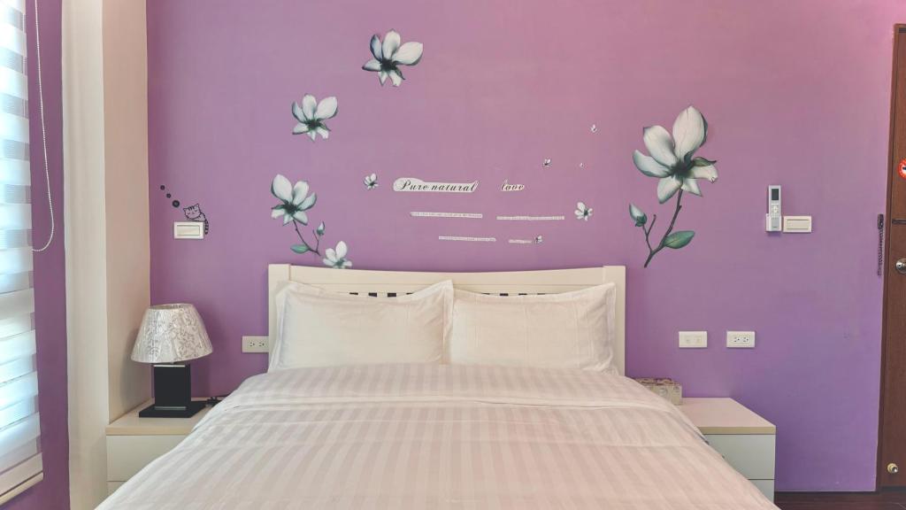 Postel nebo postele na pokoji v ubytování Kinmen 2 Home Puju Homestay