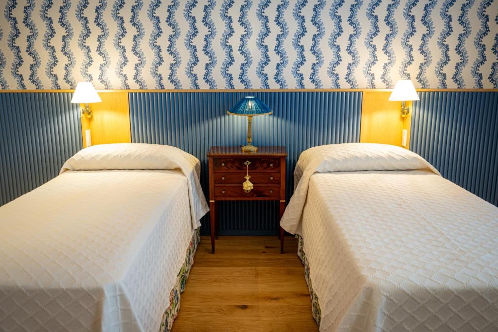 Postel nebo postele na pokoji v ubytování Albergo del Cuore