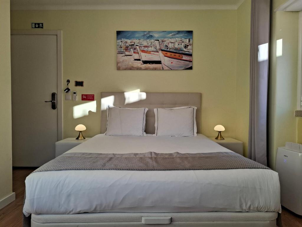 Postel nebo postele na pokoji v ubytování SK Lisboa Villa Guesthouse