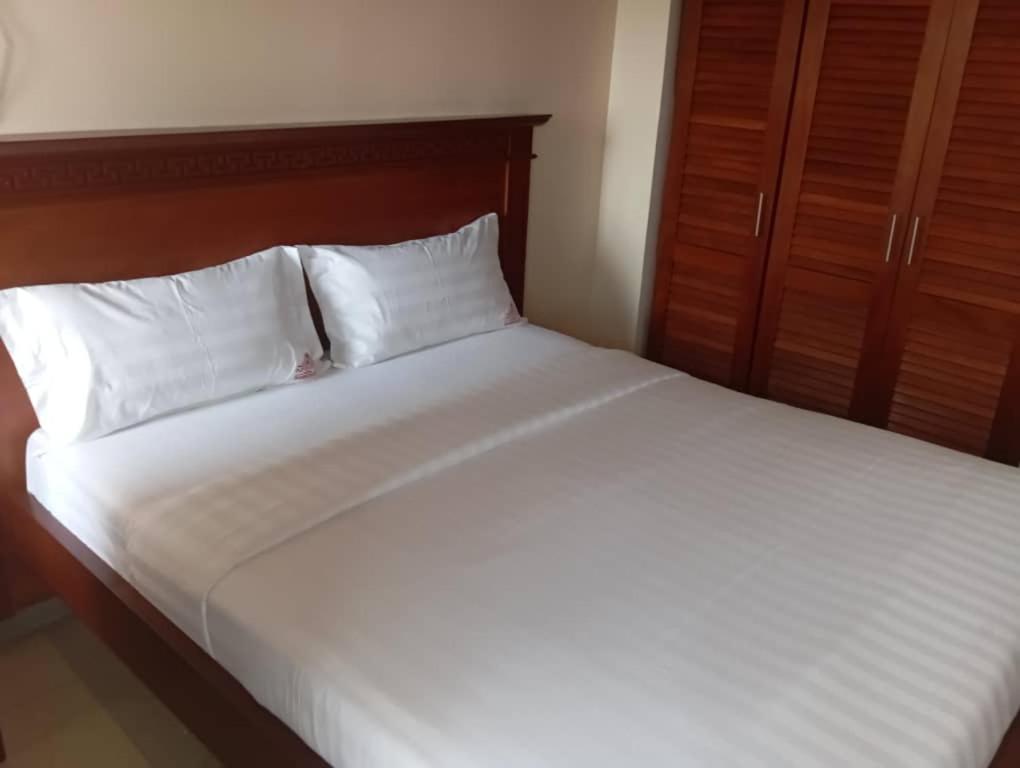 Postel nebo postele na pokoji v ubytování flamboyant hôtel