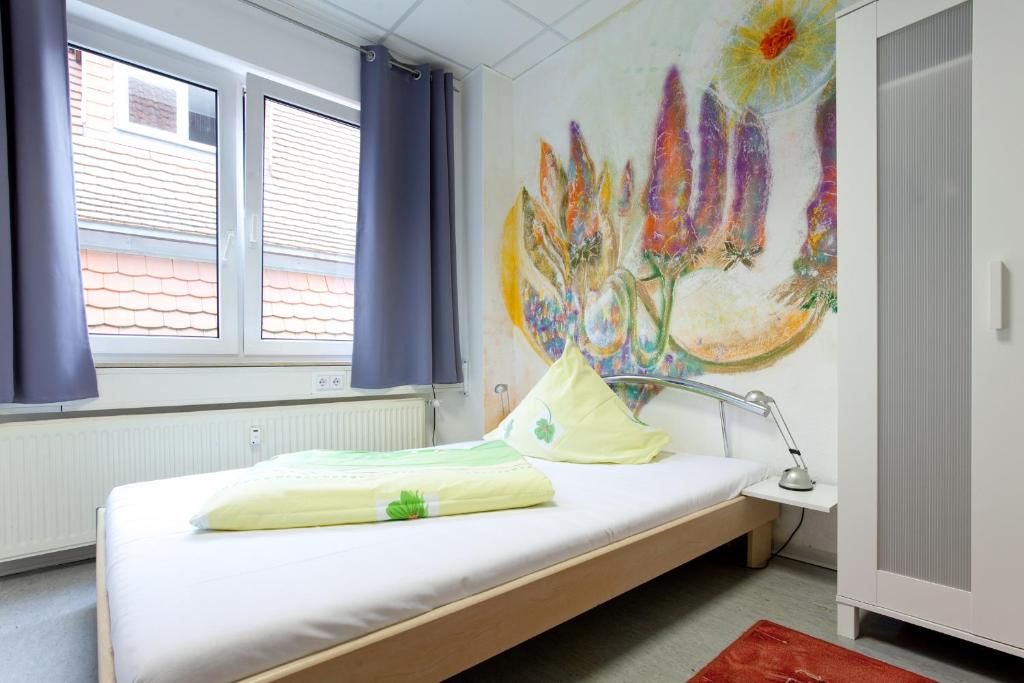 Voodi või voodid majutusasutuse Hostel Jena toas