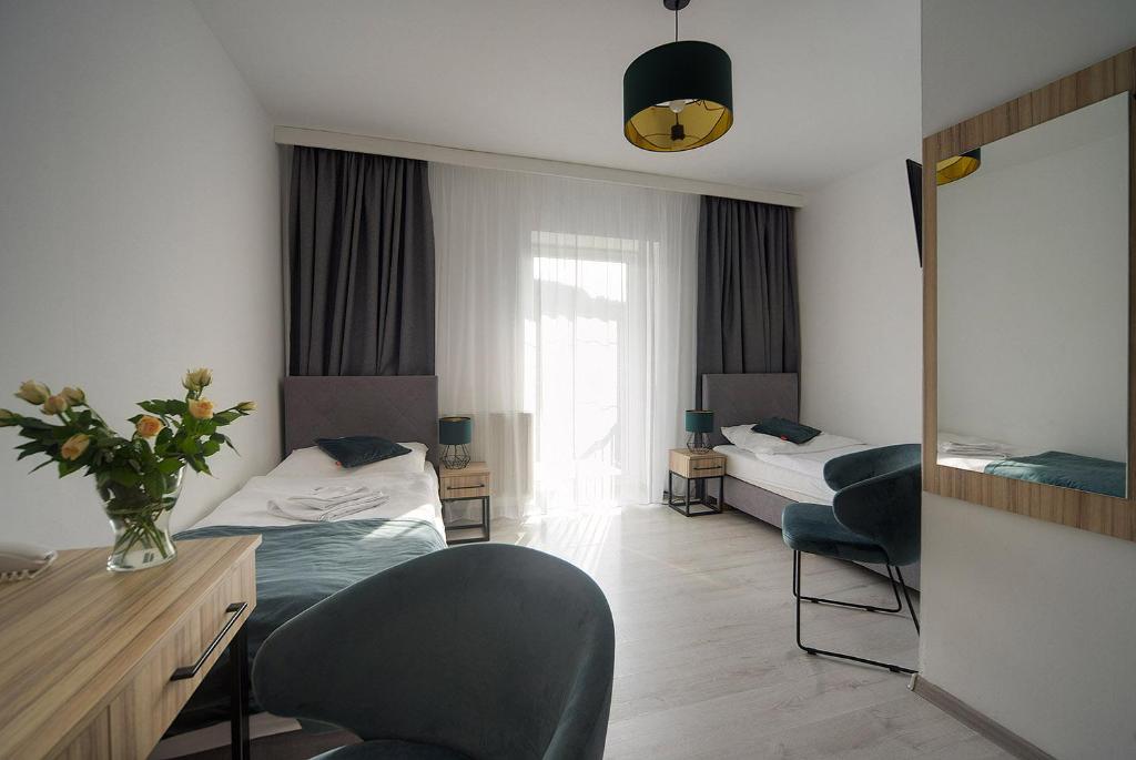 Posteľ alebo postele v izbe v ubytovaní Dobrzyński Resort Hotel Nefryt