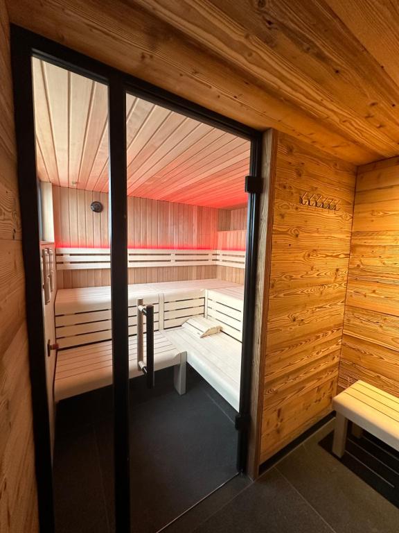 an inside view of a sauna with wooden walls at schwimmendes Ferienhaus Silent in Elsterheide