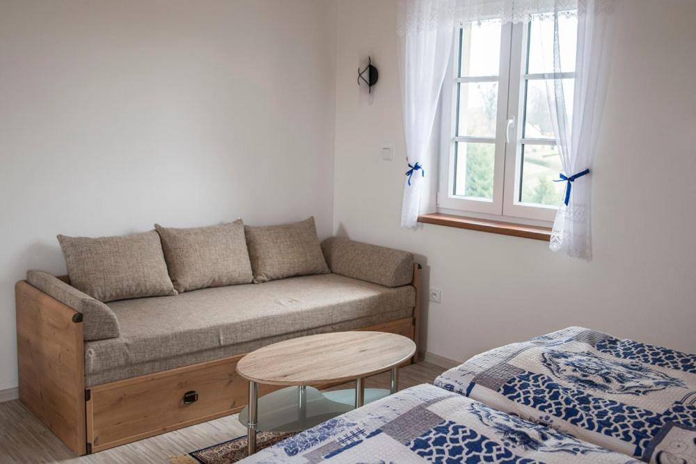 Postel nebo postele na pokoji v ubytování Penzion U Červené podkovy