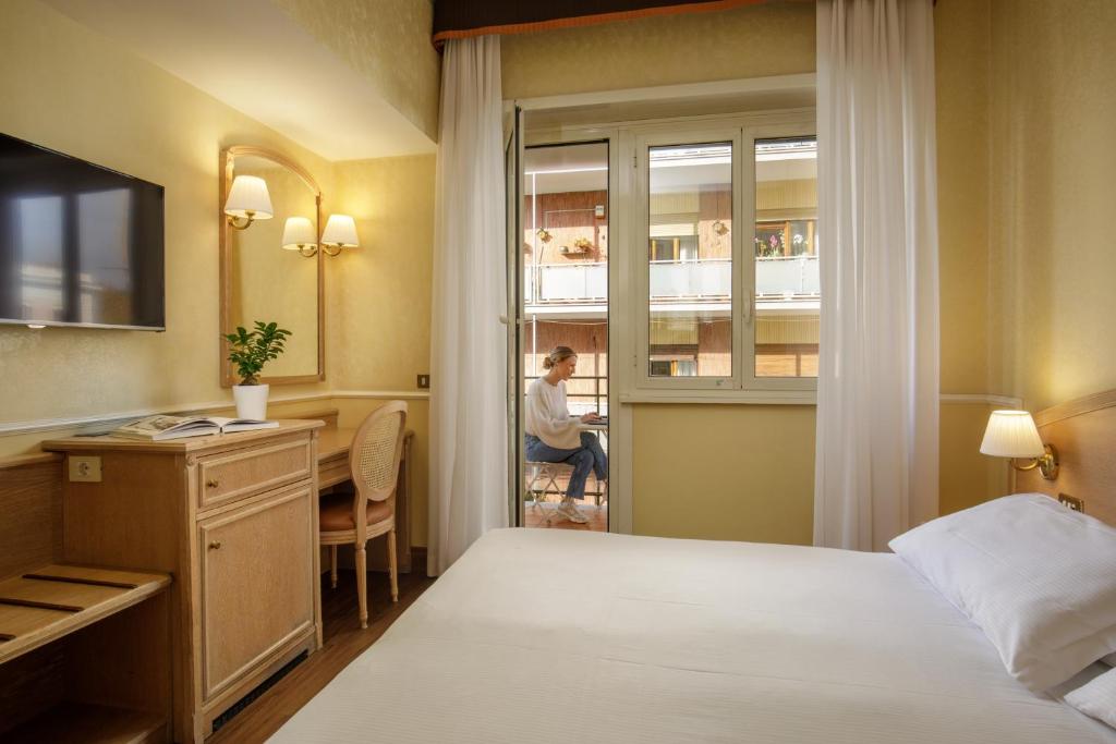 Postel nebo postele na pokoji v ubytování Hotel Santa Costanza by OMNIA hotels