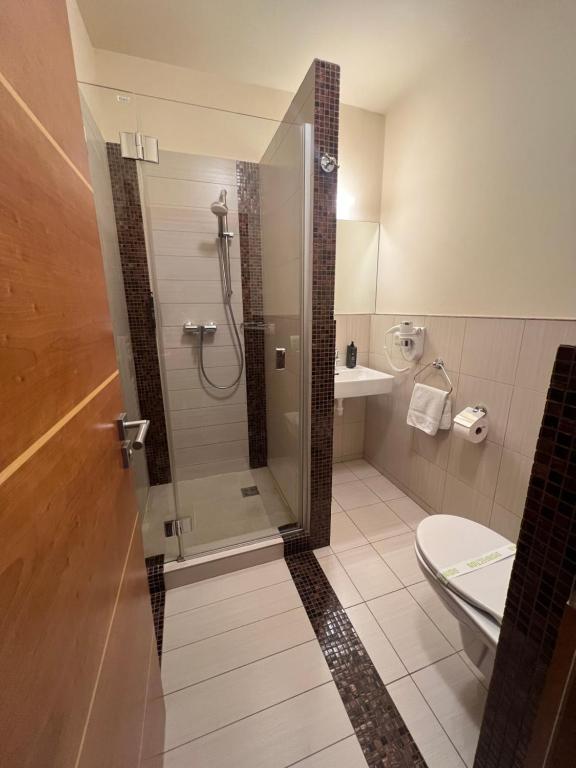 Koupelna v ubytování Privilege Apartments