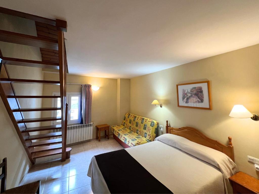 Postel nebo postele na pokoji v ubytování Hotel Juan Canejan