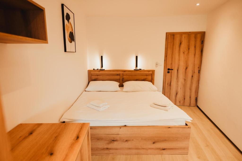 Postel nebo postele na pokoji v ubytování Hotel U Racka