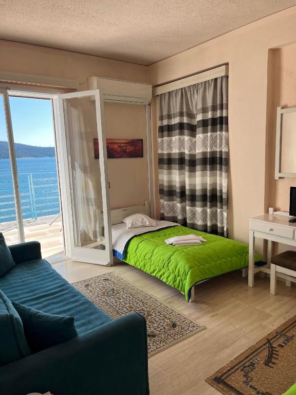 Postel nebo postele na pokoji v ubytování Hotel Stratos