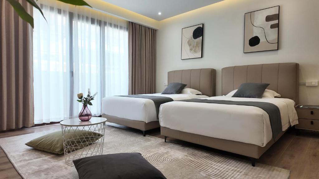 Postel nebo postele na pokoji v ubytování CC LUX Suites