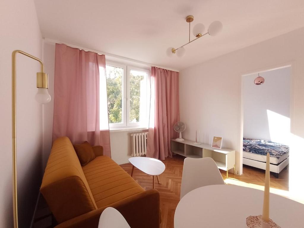 Ένα ή περισσότερα κρεβάτια σε δωμάτιο στο Apartament Stare Miasto