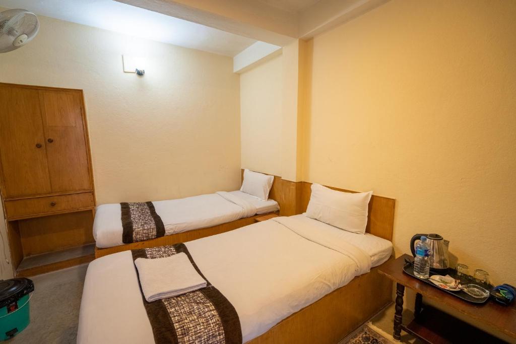 Postel nebo postele na pokoji v ubytování Hotel Nana