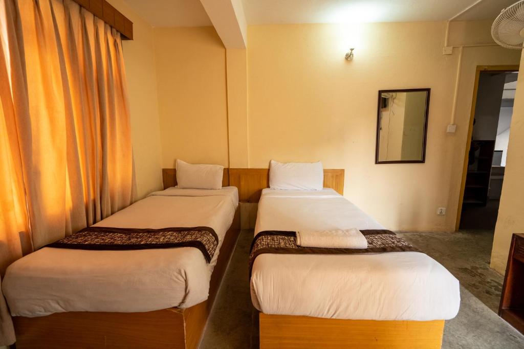 Postel nebo postele na pokoji v ubytování Hotel Nana