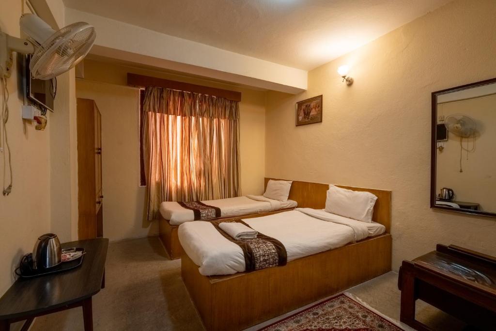 Postel nebo postele na pokoji v ubytování Hotel Nana