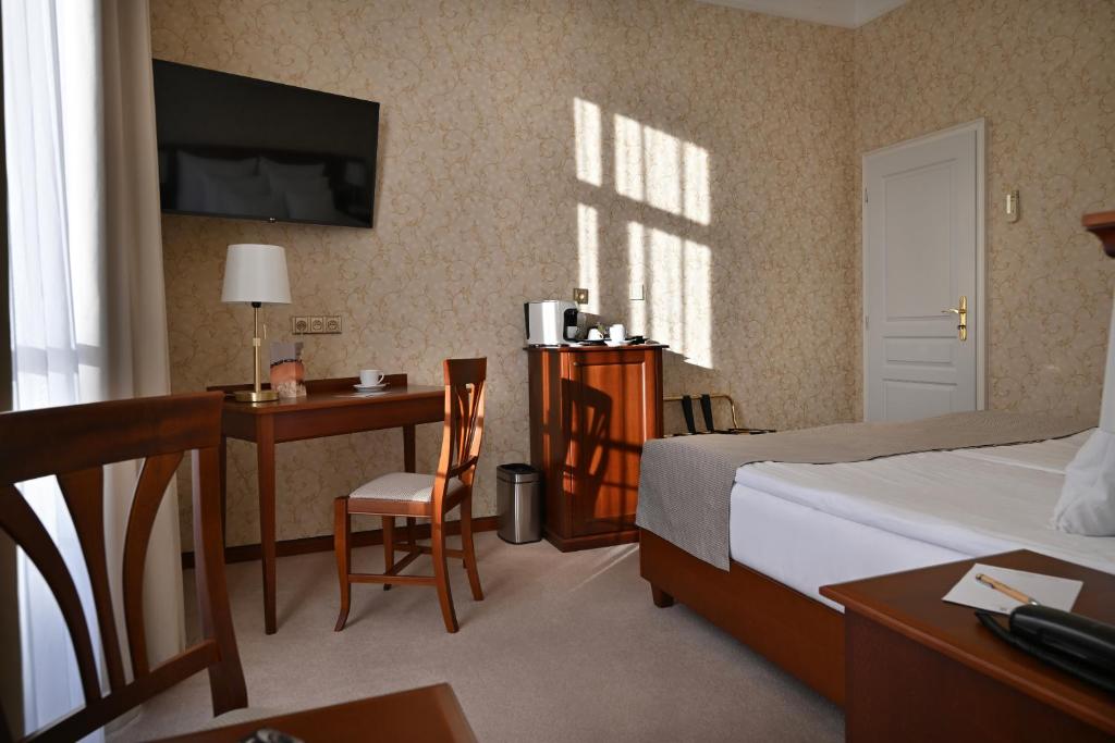 Postel nebo postele na pokoji v ubytování Hotel Rott