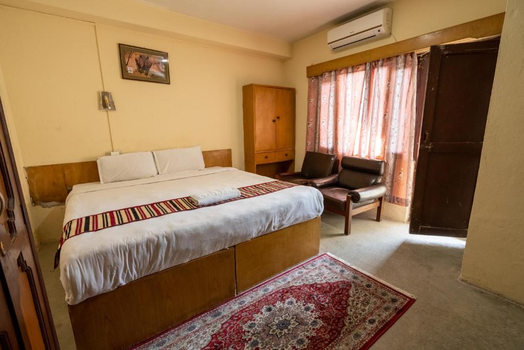Postel nebo postele na pokoji v ubytování Hotel Nana