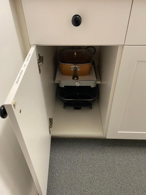 a drawer in a cabinet with a suitcase in it at Our Place Up North BnB in Huntsville