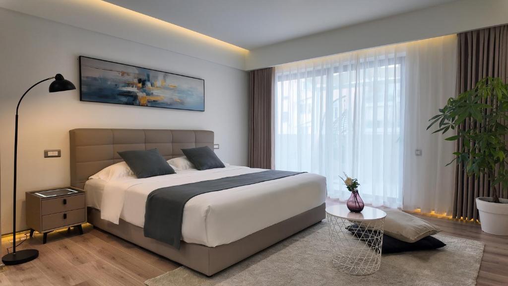 Postel nebo postele na pokoji v ubytování CC LUX Suites