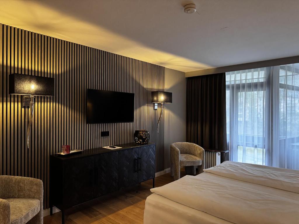 Postel nebo postele na pokoji v ubytování Hotel Luisenpark